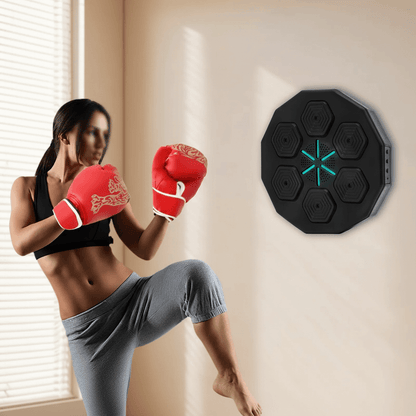 Best music boxing machine being used by woman in red boxing gloves practicing martial arts